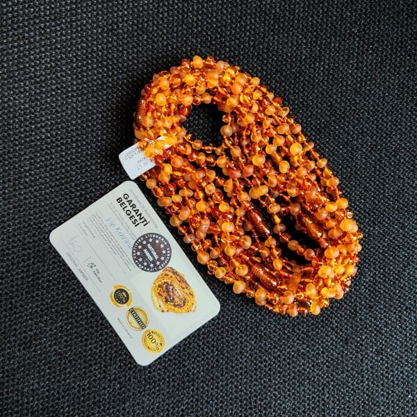 4.5 Gram Mat-Cilalı Konyak Rengi Kehribar Bebek Diş Kolyesi